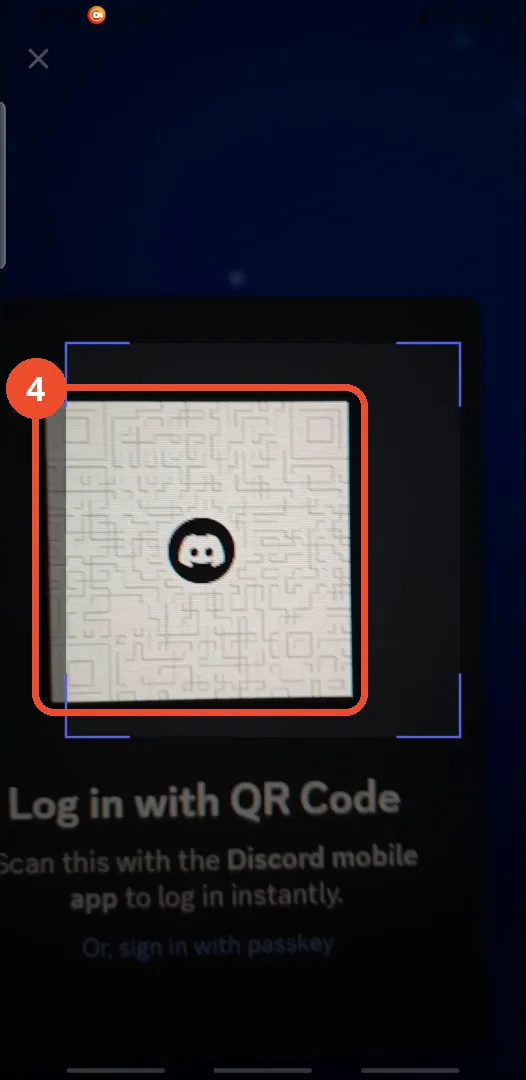 Point the camera at the QR code on the computer