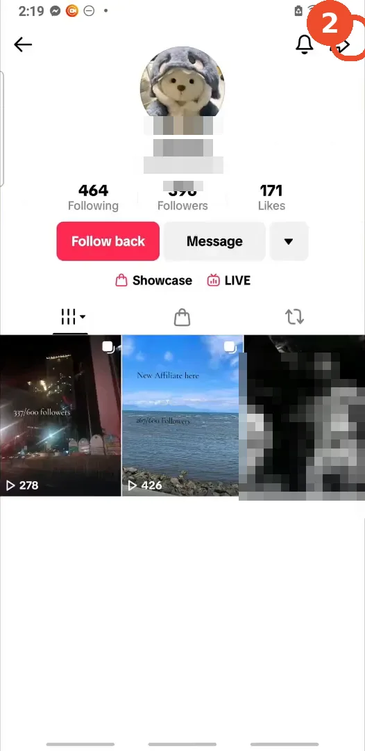 Tap the share icon on their profile