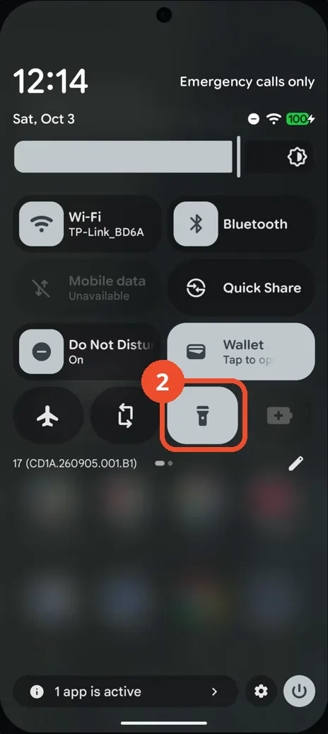Tap the Flashlight tile — it lights up when the flashlight is on