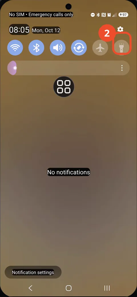Tap the Flashlight tile